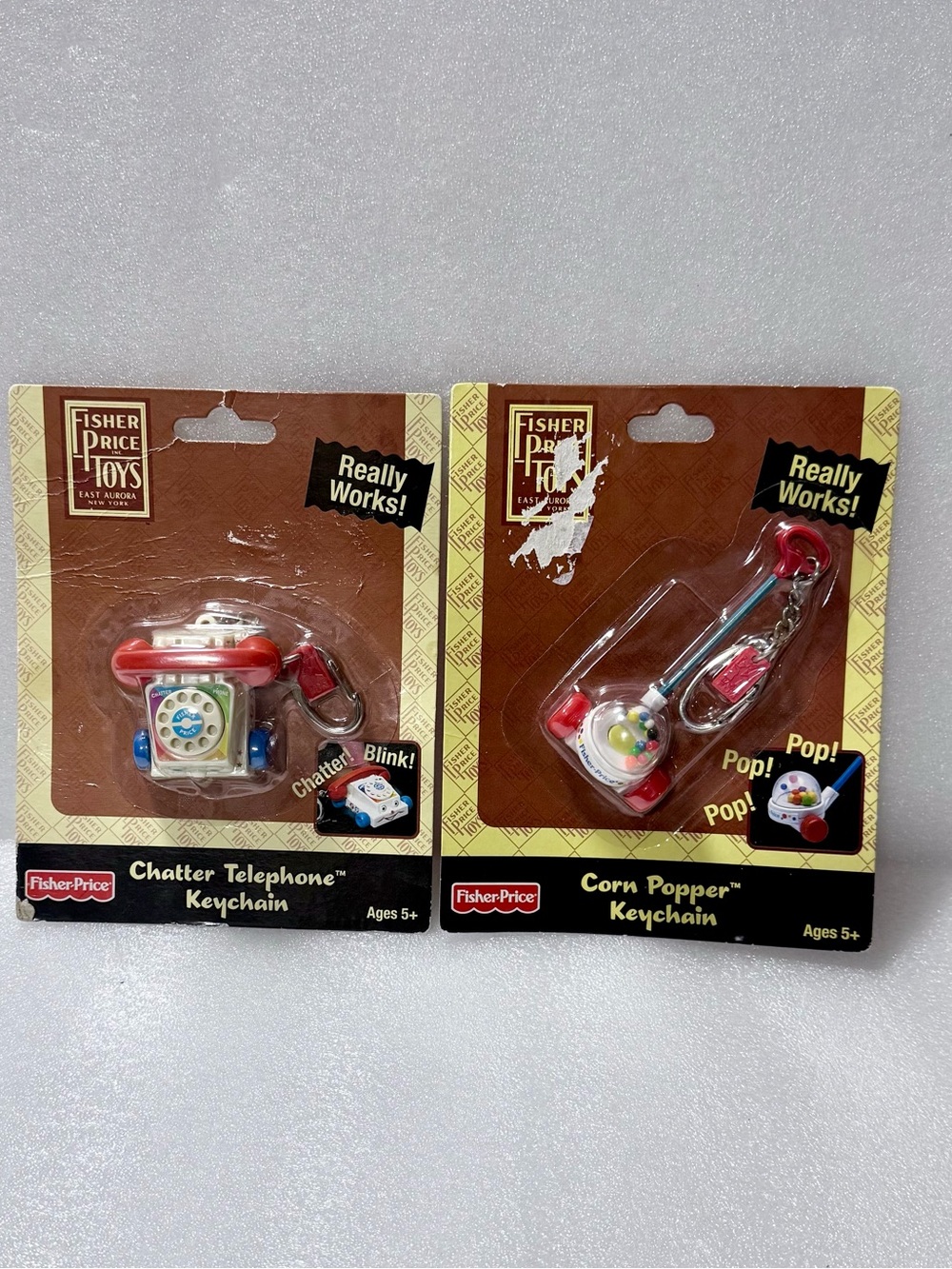 Fisher-Price Keychains Keyrings Mini Toys: corn Popper  and  Chatter Phone